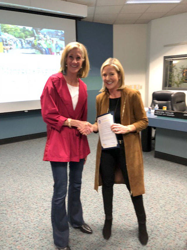 Mayor Debbie Bertlin and KCSARC board member Lawton Penn help proclaim April as Sexual Assault Awareness Month in Mercer Island. Photo courtesy of the city of Mercer Island