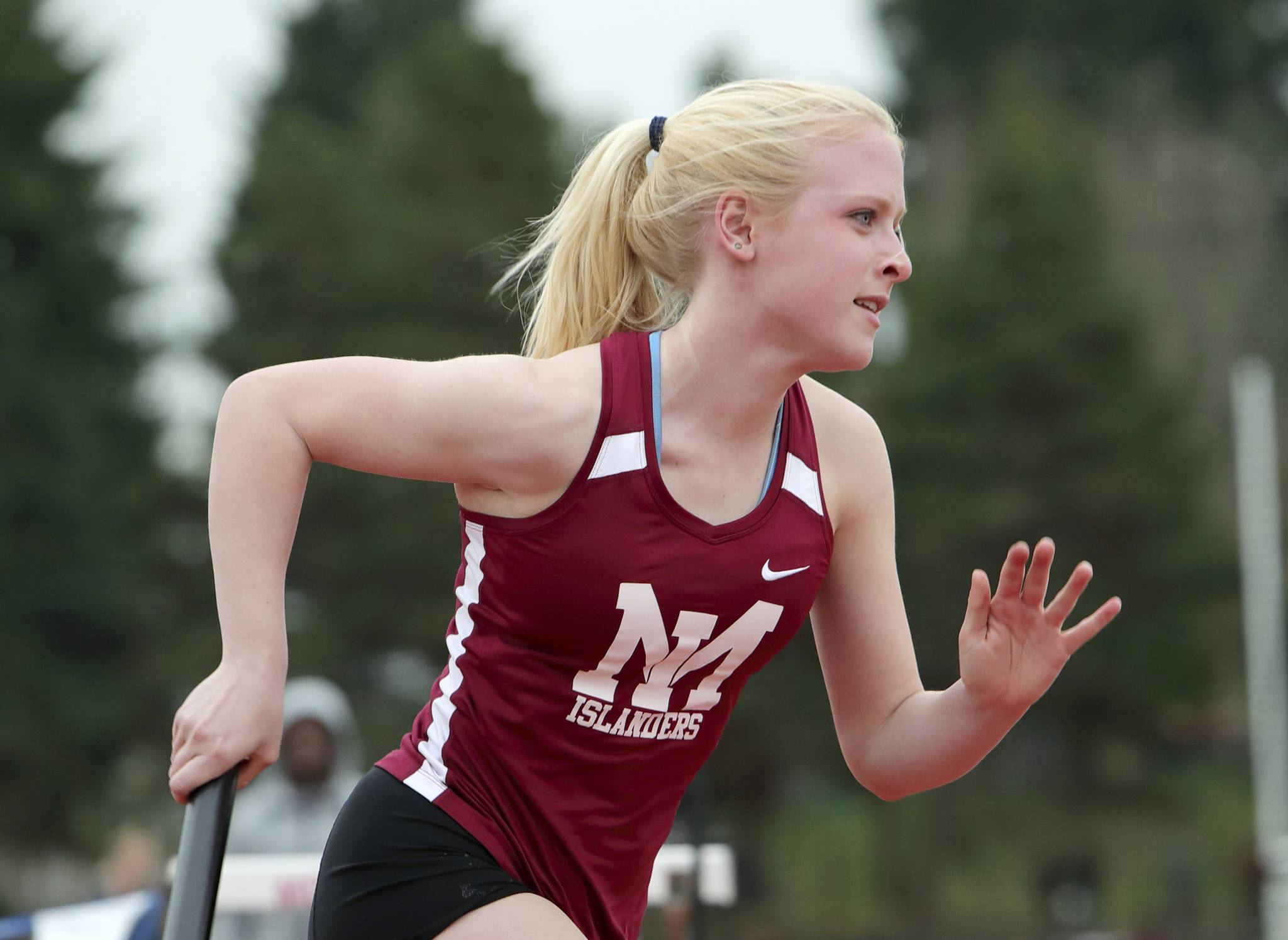 Photo courtesy of Jay Na The Mercer Island Islanders girls track team earned a 84-65 victory against the Liberty Patriots on April 5. The Islanders improved their overall record to 5-0 with the victory. Islanders athletes earning first place in their respective events consisted of Gretchen Blohm (200, 400 relay, 800 relay, 1600 relay), Margaret Baker (400, 800 relay, 1600 relay), Chloe Michaels (1600, 3200), Maya Virdell (300 hurdles, 400 relay, 800 relay, 1600 relay), Eliza Crenshaw (400 relay, 800 relay), Katie McCormick (400 relay, high jump), Ella Hensey (1600 relay, long jump), Faith Osei-Tutu (shot-put) and Aleksandra Kogalovski (pole vault). Crenshaw (pictured) competes in the 800-meter relay against Liberty.