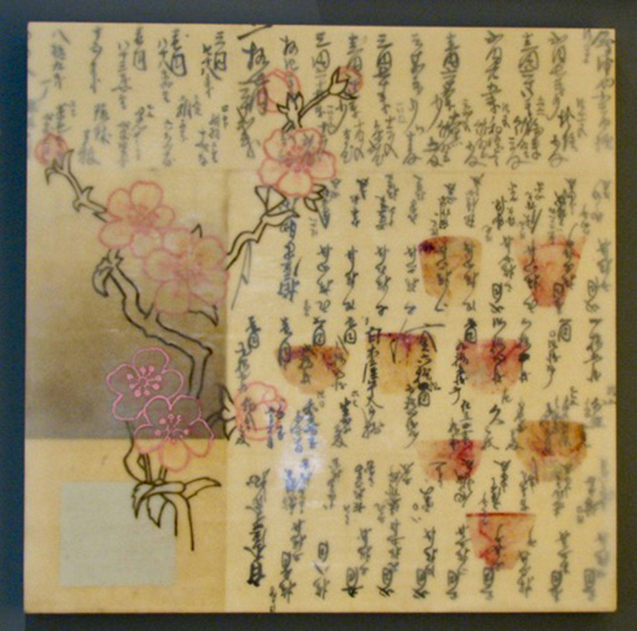 Mercer Island’s Clarke and Clarke Art and Artifacts will feature works from Valaree Cox’s new Encaustic series, “The Way Of Tea,” at its First Friday art and wine walk on May 4. The beautiful paper and exquisite writing is the background for hand cut paper chrysanthemums, Kanji and teabag stains, which are incorporated into each painting. Photo courtesy of Ginny Clarke