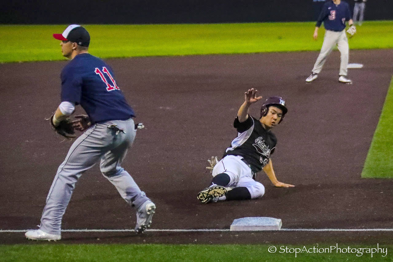 Photo courtesy of Don Borin/Stop Action Photography                                Mercer Island Islanders senior first baseman Justin Ho slides safely into third base against the Juanita Rebels in the KingCo 3A championship game. The Islanders defeated the Rebels 11-1 on May 5 at Bannerwood Park in Bellevue.