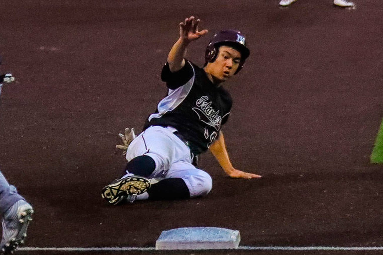 Photo courtesy of Don Borin/Stop Action Photography                                Mercer Island Islanders senior first baseman Justin Ho slides safely into third base against the Juanita Rebels in the KingCo 3A championship game. The Islanders defeated the Rebels 11-1 on May 5 at Bannerwood Park in Bellevue.