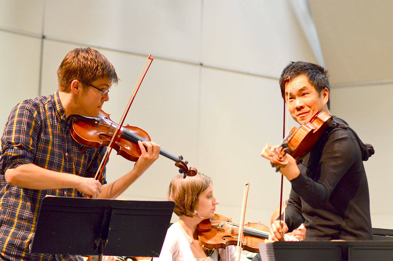 James Garlick, left, and Richard O’Neill, here rehearsing for a 2017 Port Angeles Symphony concert, are artistic directors of the new Music on the Strait festival. (Diane Urbani de la Paz/for Peninsula Daily News)