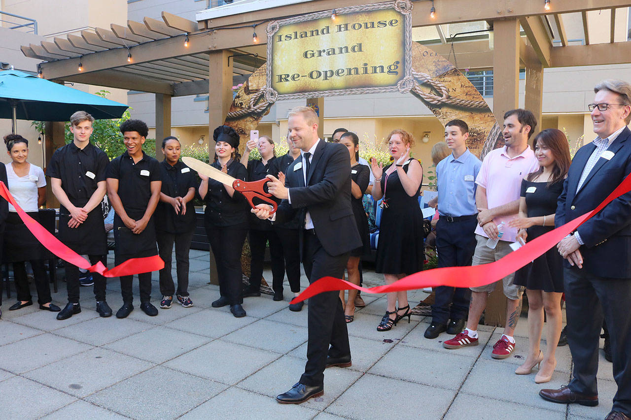 MBK Senior Living staff cut the ribbon at Island House in Mercer Island, reopening it to the community after a remodel. Katie Metzger/staff photo