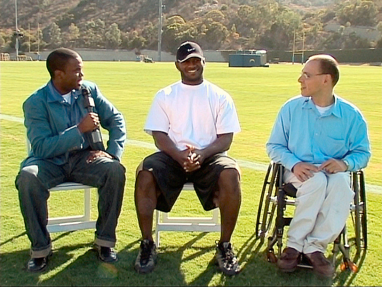 Hallstrom and Brown interviewing San Diego Chargers running back LaDainian Tomlinson (middle) in 2007. Tomlinson was the reigning MVP of the NFL that year. Courtesy of Thunder Sports Network.