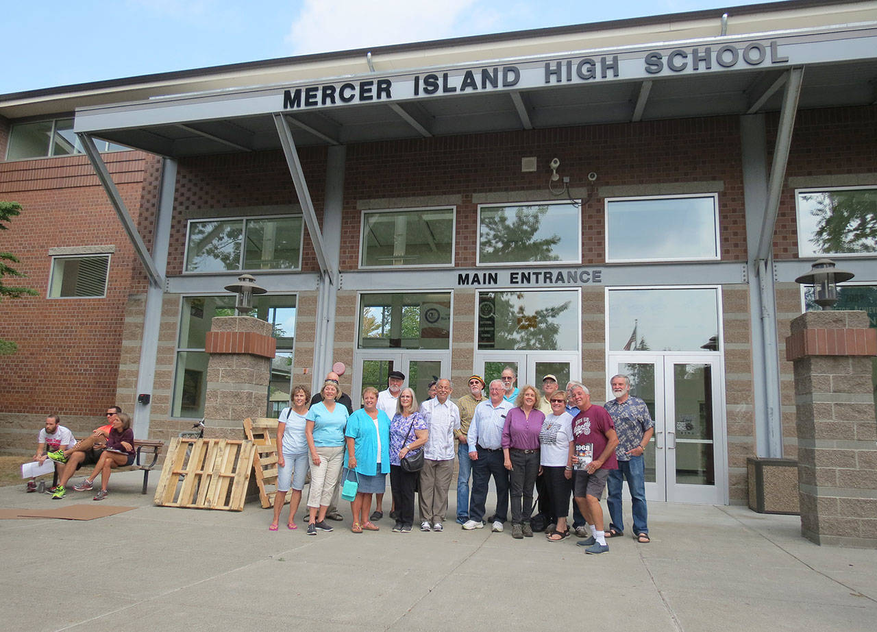 Some members of the Mercer Island High School Class of 1968 pose outside their alma mater on Aug. 24 for their 50th reunion. Photo courtesy of Clay Eals