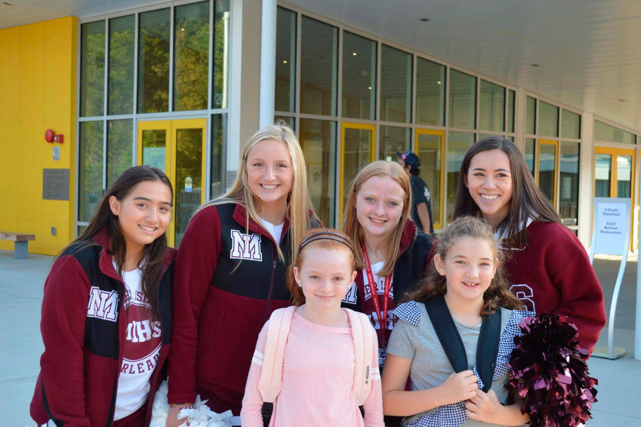 The MIHS cheer squad greets students on their first day at Northwood Elementary. Photo courtesy of Craig Degginger/Mercer Island School District