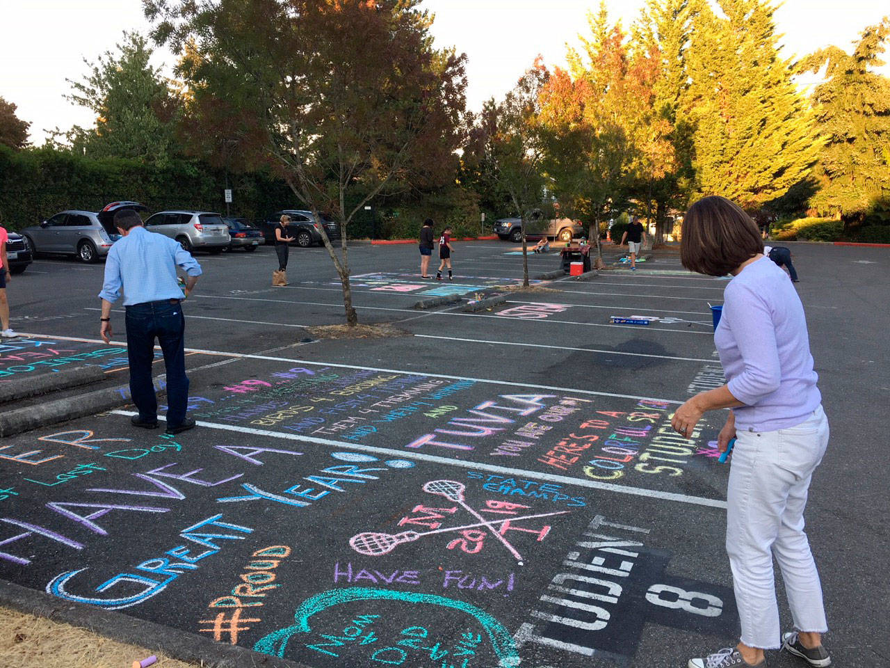 Senior parents decorate spots in the MIHS parking lot. Photo courtesy of Anne Hritzay