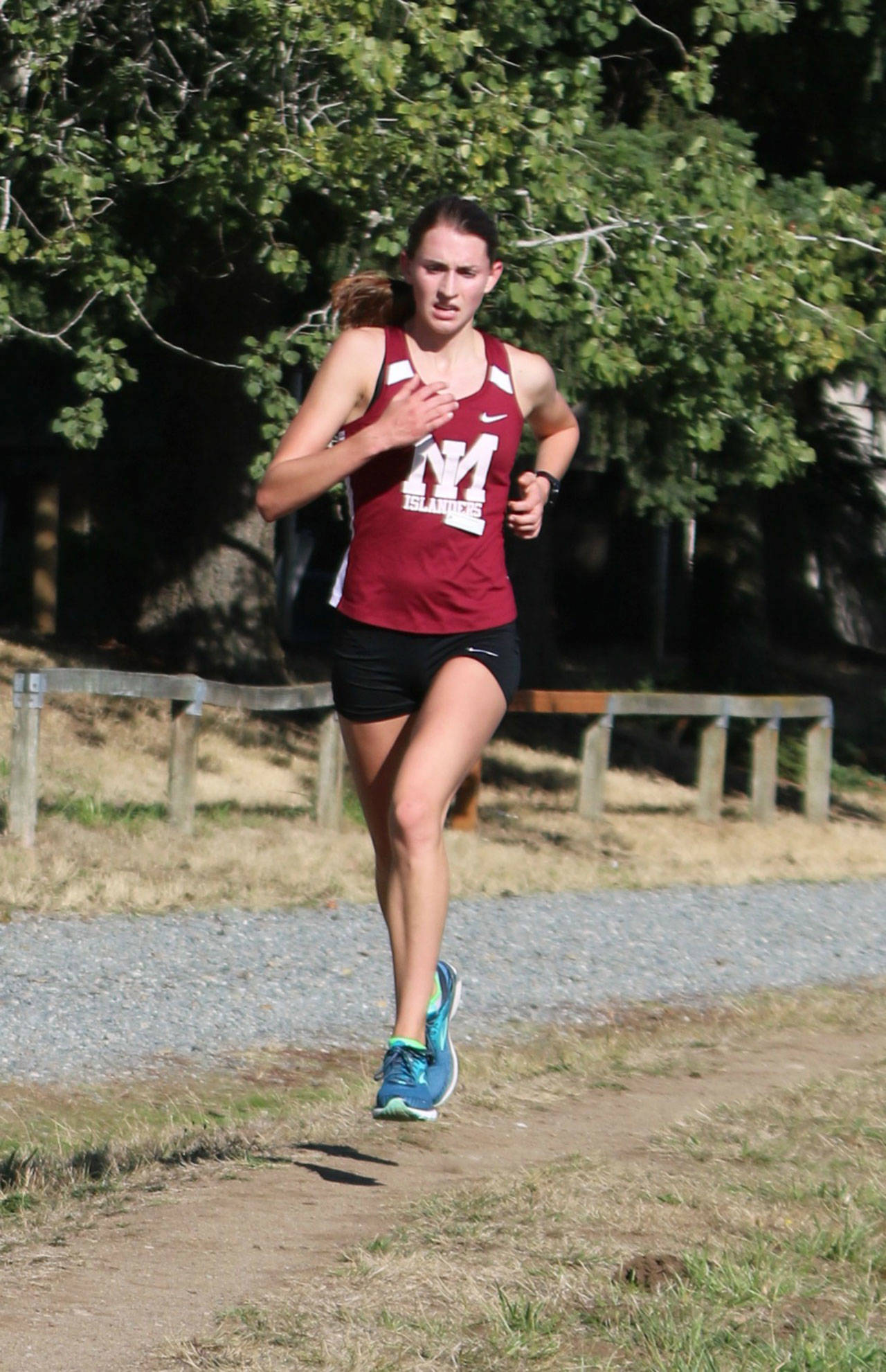 Mercer Island’s Maggie Baker leads the way at a cross country meet against Lake Washington and Juanita on Sept. 17 at Marymoor Park. Andy Nystrom / staff photo