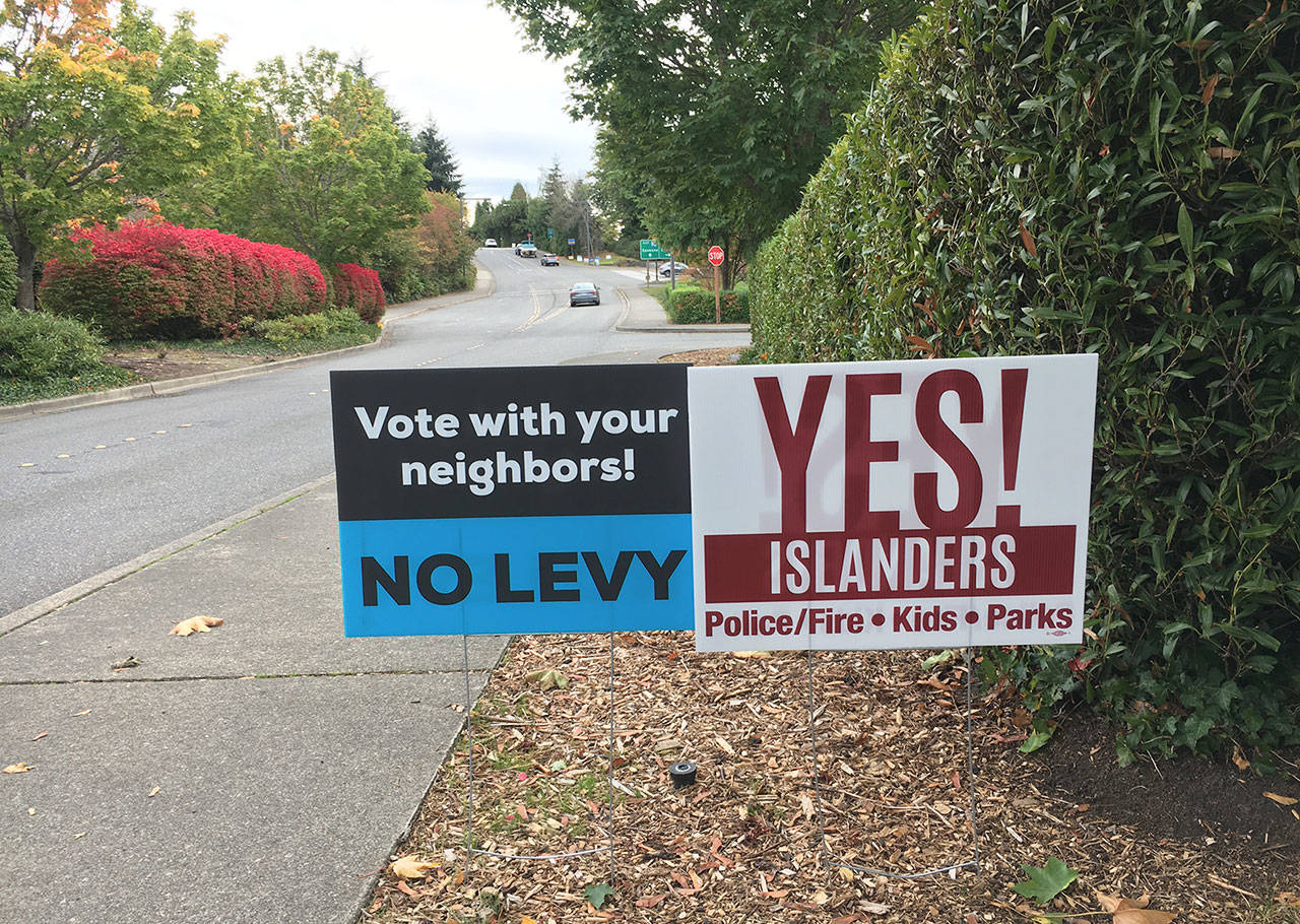 Signs supporting and opposing the city’s ballot measure can be found all over the Island. Katie Metzger/staff photo