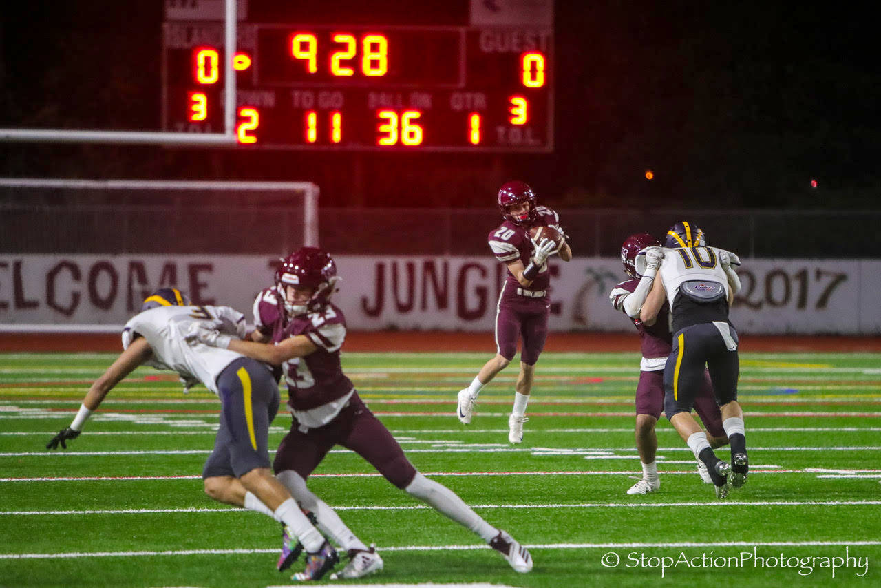Mercer Island junior Carter Burr (pictured) catches a pass in the flat from quaterback Clay Dippold in the first quarter of play against Bellevue. Bellevue defeated Mercer Island, 47-0, on Oct. 26. Photo courtesy of Don Borin/Stop Action Photography