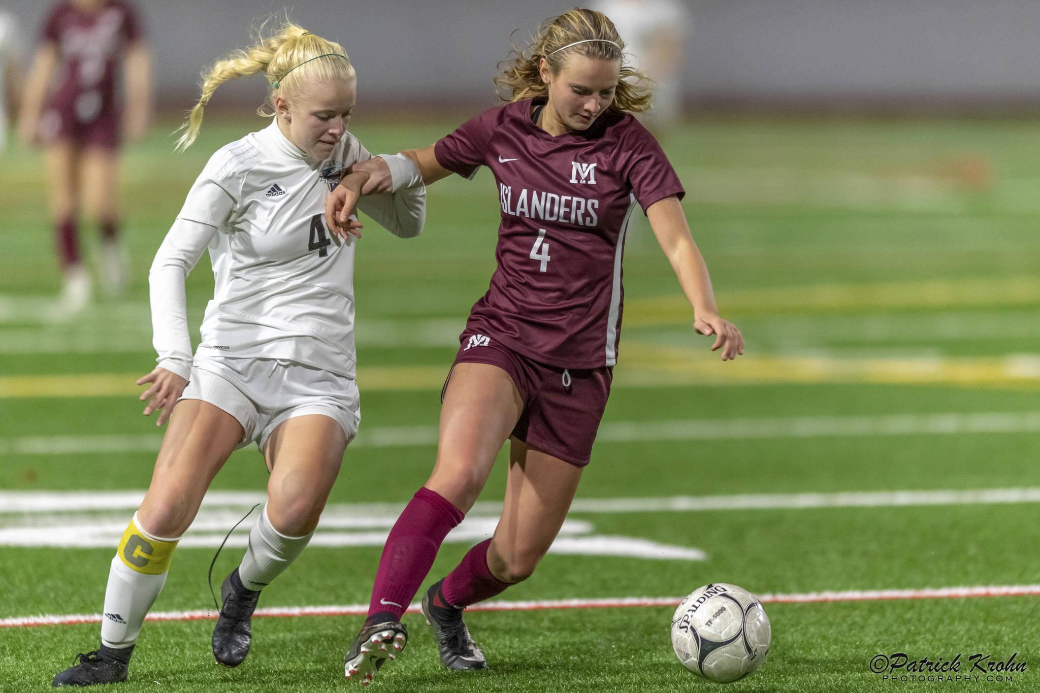 Mercer Island senior midfielder Jackie Stenberg, right, tries to keep the ball away from Bonney Lake midfielder Summer Kober, left, in the first round of the Class 3A state playoffs on Nov. 6 at Mercer Island High School. Photo courtesy of Patrick Krohn/Patrick Krohn Photography