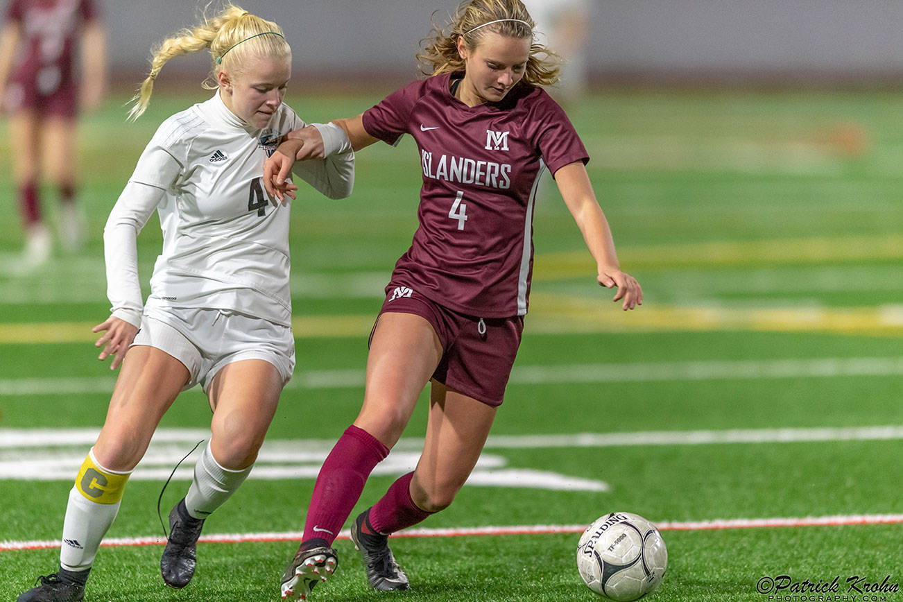 Mercer Island senior midfielder Jackie Stenberg, right, tries to keep the ball away from Bonney Lake midfielder Summer Kober, left, in the first round of the Class 3A state playoffs on Nov. 6 at Mercer Island High School. Photo courtesy of Patrick Krohn/Patrick Krohn Photography