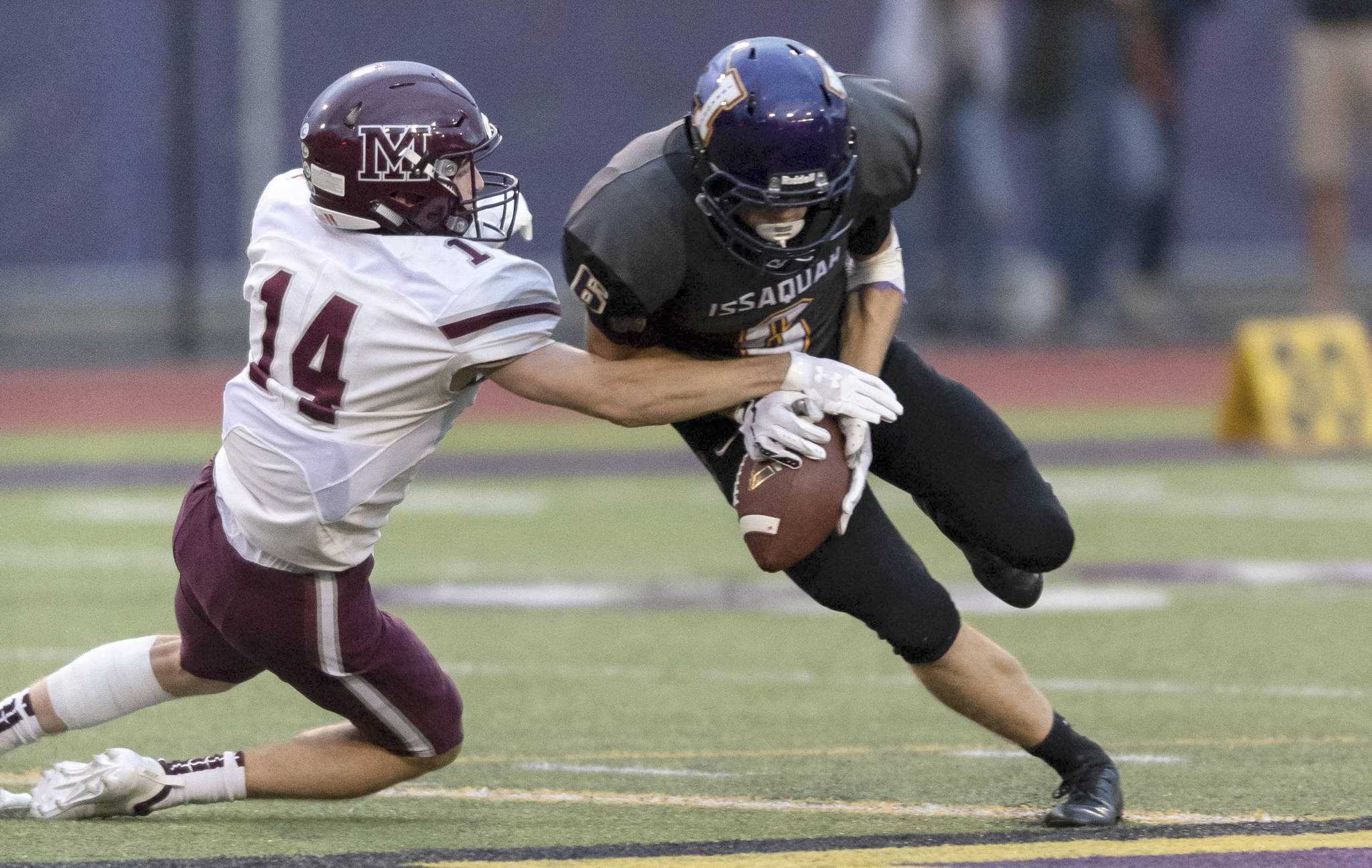 Mercer Island football player Hunter Johnson, left, makes a play against the Issaquah Eagles during a non-league game this past September. Johnson was one of three Islanders football players that captured 2A/3A KingCo first-team, all-league honors. Photo courtesy of Patrick Krohn/Patrick Krohn Photography