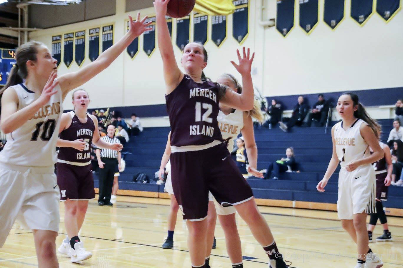 Mercer Island Islanders basketball player Sarah Gest takes the ball to the hoop against the Bellevue Wolverines in a game during the 2017-18 season. Gest is a senior this year. Photo courtesy of Don Borin/Stop Action Photography