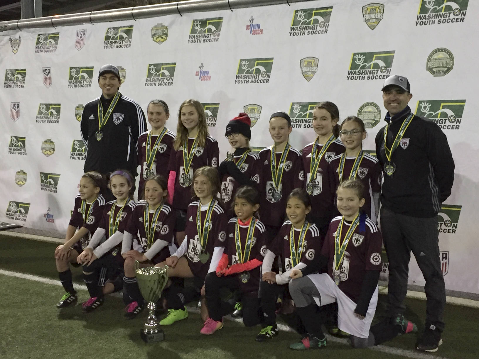 The Mercer Island Flames U-11 girls soccer team won the Washington Youth Soccer Regional Recreational Cup on Dec. 2. The Flames finished the 2018 season with an undefeated record of 16-0. Members of the Flame roster included Sophia Kinkead, Sabina Leveque, Scout Bates, Quincey Eskridge, Ciela Turner, Ashlyn Belden, Avery Oliver, Mia Sung, Chloe Mar, Bryanna Denmarsh, Amelie Swift, Gianna Tubach, Elianna Weiss and Cate Thomas. The team was coached by David Tubach, Adam Kinkead and Scott Weiss. Photo courtesy of David Tubach