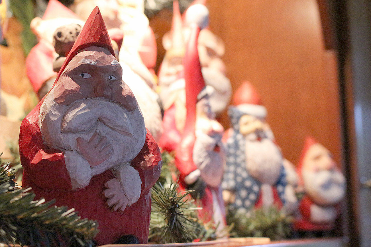 Phil Sedlacek has been carving Santas out of wood for over 40 years. Madison Miller/staff photos