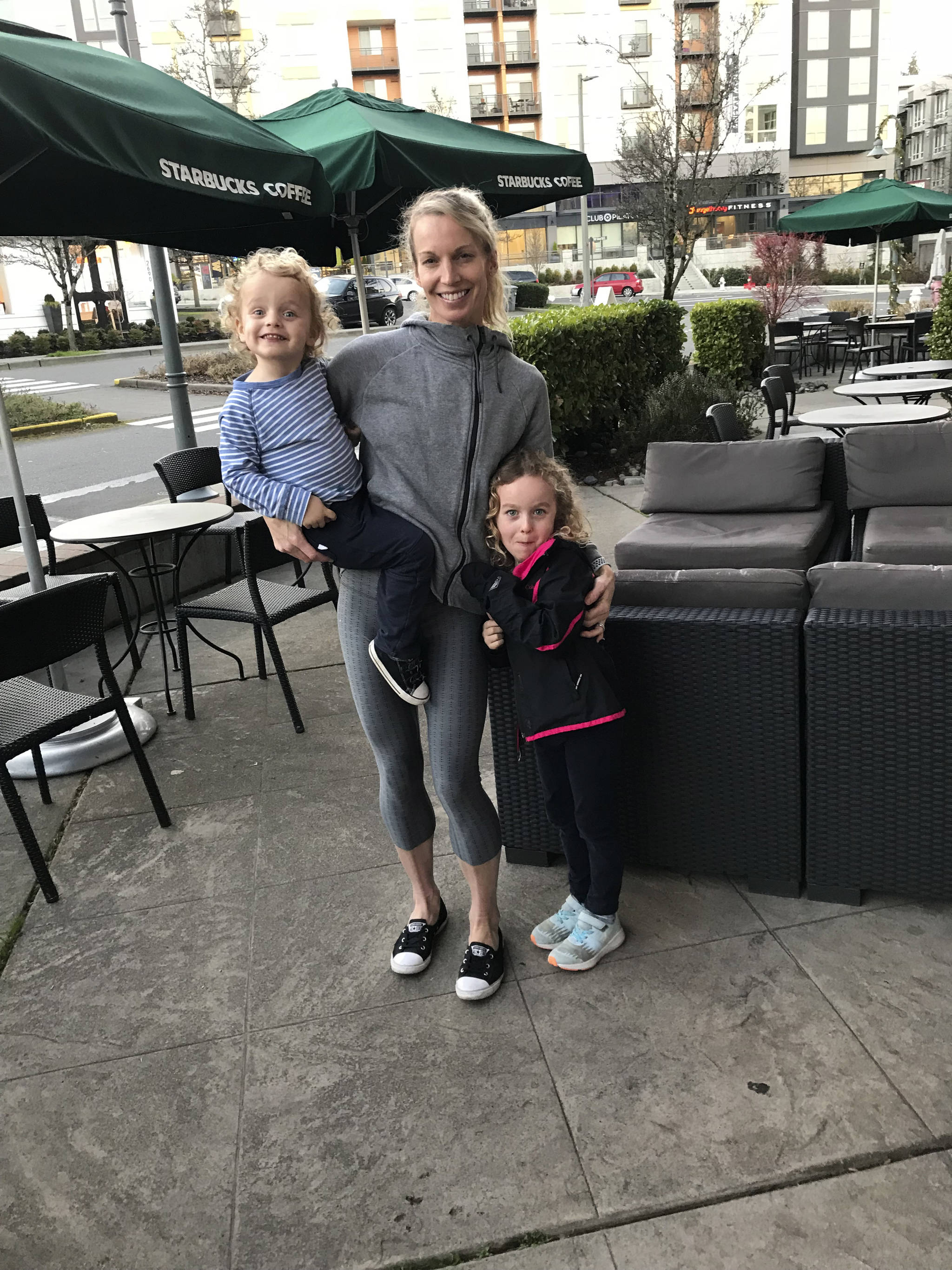 Mercer Island resident Desiree Berry, pictured with her children Beau, 5, and Bear, 3, clinched a berth at the United States Olympic trials after clocking a time of 2:39.17 at the Cal International Marathon on Dec. 2 in Sacramento, California. Shaun Scott, staff photo