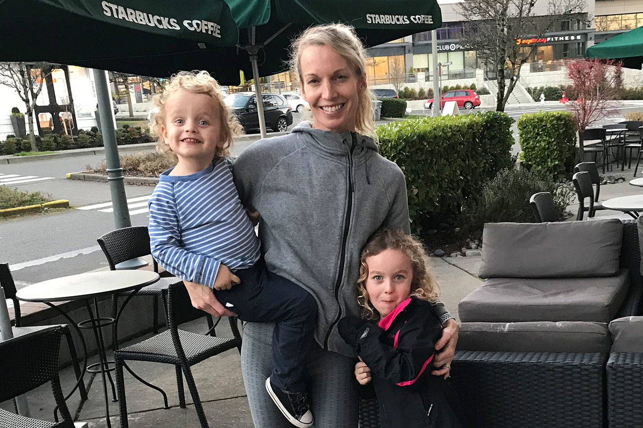 Mercer Island resident Desiree Berry, pictured with her children Beau, 5, and Bear, 3, clinched a berth at the United States Olympic trials after clocking a time of 2:39.17 at the Cal International Marathon on Dec. 2 in Sacramento, California. Shaun Scott, staff photo