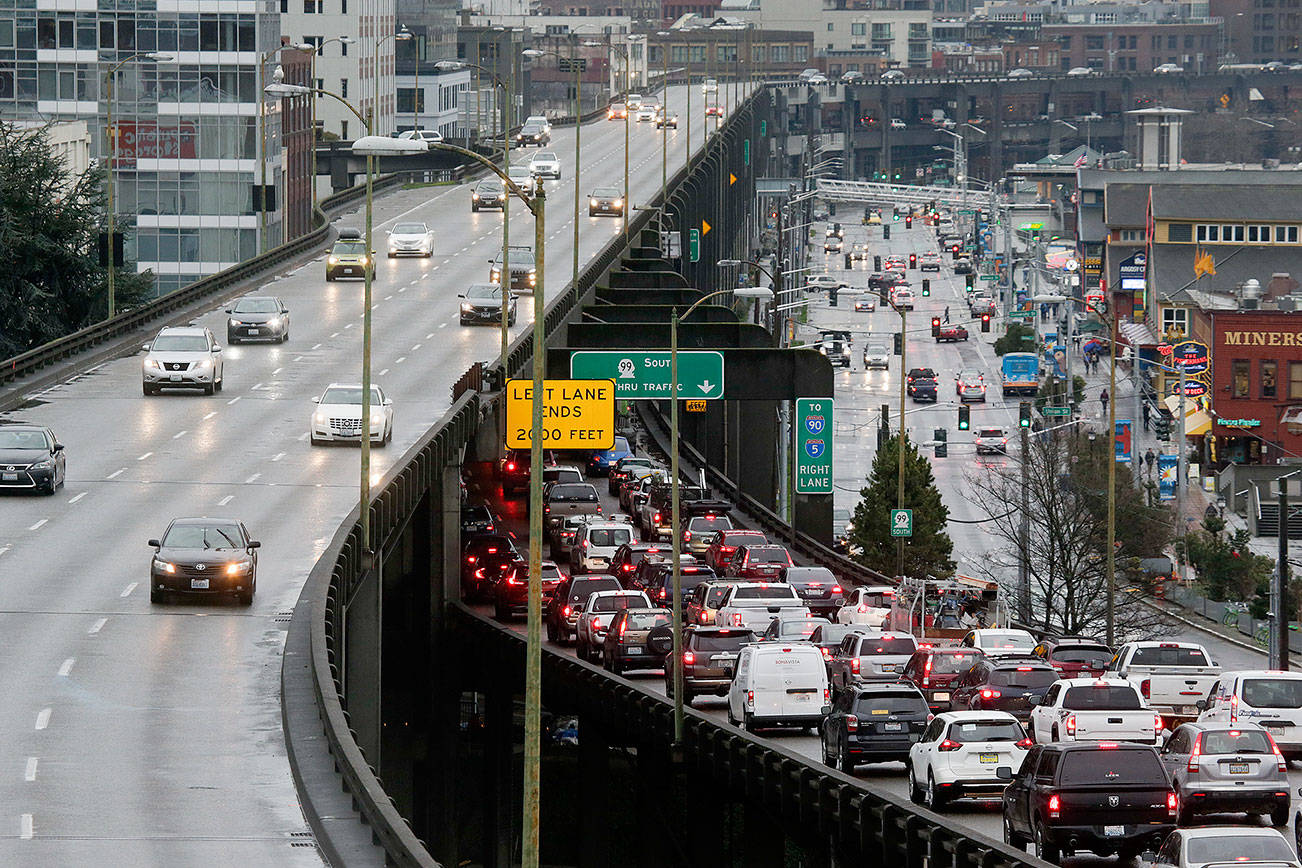 Southbound traffic backs up as northbound drivers cruise on with ease on the State Route 99 viaduct three days before its closure. (Andy Bronson / The Herald)