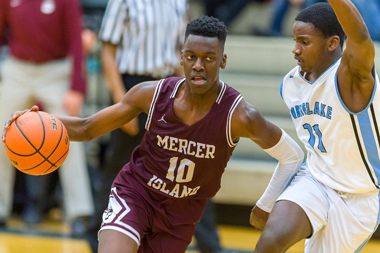 Mercer Island Islanders guard Nigel Seda, left, scored a team-high 15 points against the Interlake Saints on Jan. 22. Mercer Island defeated Interlake 63-46. Photo courtesy of Patrick Krohn/Patrick Krohn Photography