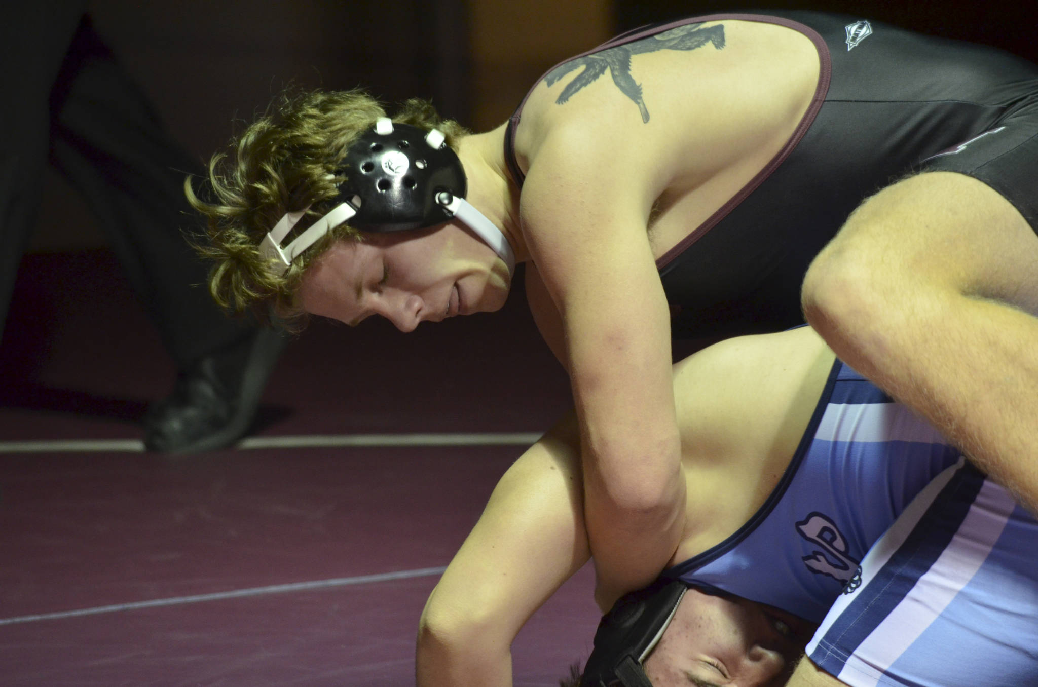 Mercer Island 220-pound wrestler Donnie Howard, pictured, pinned Interlake wrestler Cole Mullenix in their matchup on Jan. 17. The Islanders defeated the Saints 44-24 in the dual match. Photo courtesy of Billy Pruchno