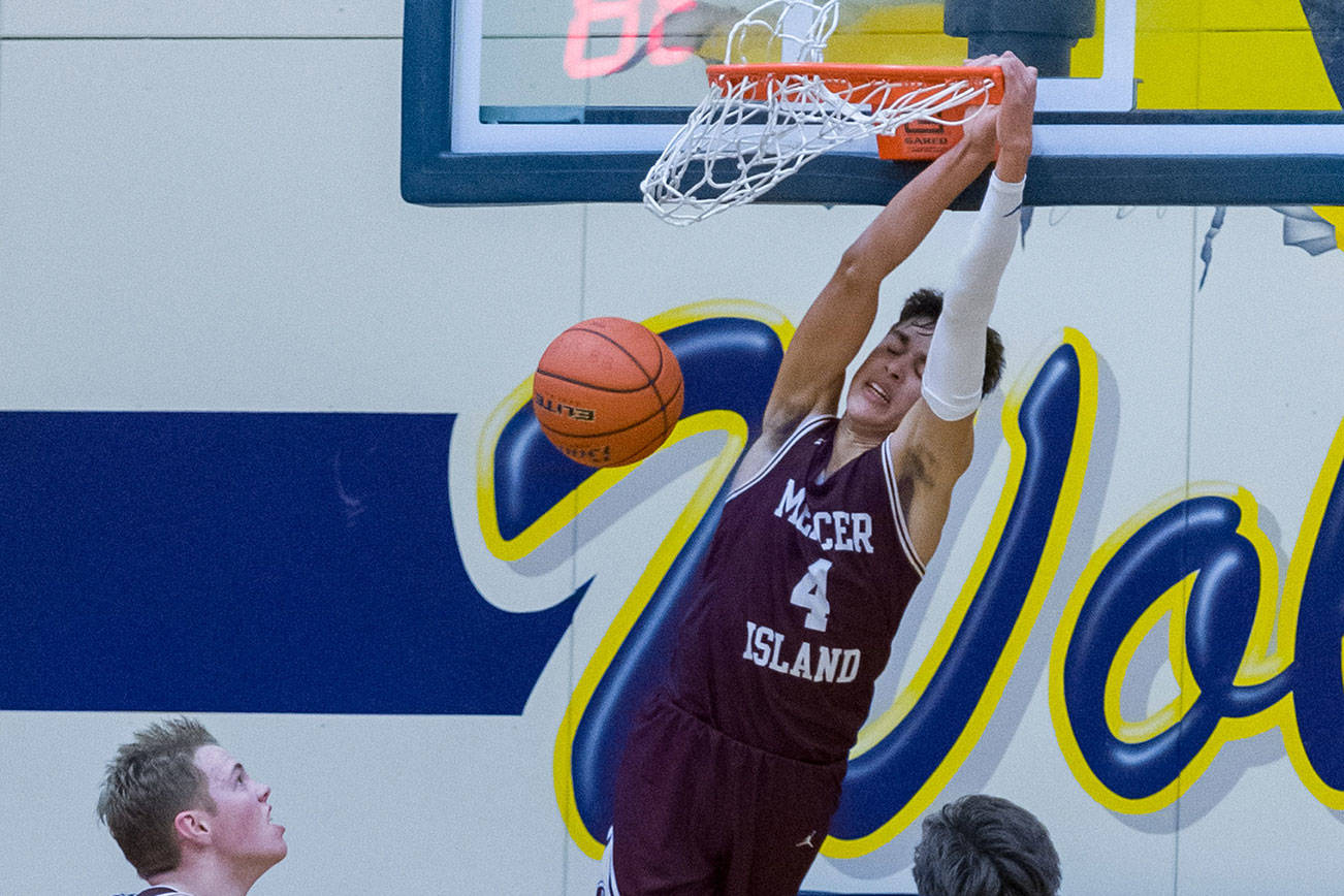 The Mercer Island Islanders boys basketball team registered a 57-41 win on the road against the Bellevue Wolverines on Feb. 1 in Bellevue. Adam Parker (pictured with the dunk) scored a team-high 22 points against the Wolverines. The Islanders clinched the 2A/3A KingCo regular season title with the victory. Mercer Island, who currently has an overall record of 16-4, have won eight consecutive games. Photo courtesy of Patrick Krohn/Patrick Krohn Photography