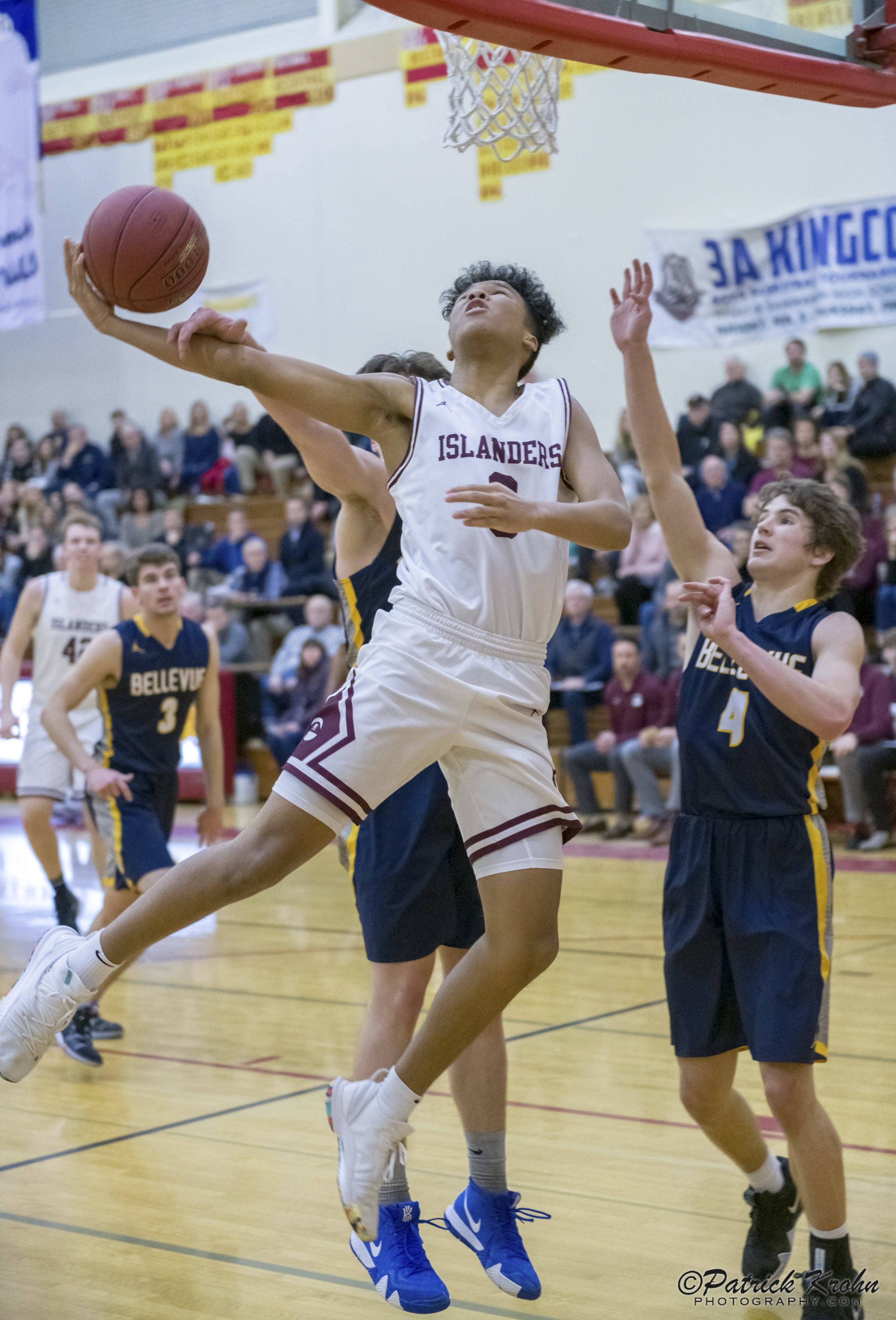 Mercer Island Islanders freshman Chris Clark (pictured) drives to the hoop in the fourth quarter against the Bellevue Wolverines in the 3A KingCo tournament championship game on Feb. 6 at Newport High School in Factoria. The Islanders defeated the Wolverines 44-41. Photo courtesy of Patrick Krohn/Patrick Krohn Photography