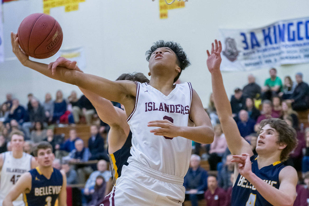 Mercer Island Islanders freshman Chris Clark (pictured) drives to the hoop in the fourth quarter against the Bellevue Wolverines in the 3A KingCo tournament championship game on Feb. 6 at Newport High School in Factoria. The Islanders defeated the Wolverines 44-41. Photo courtesy of Patrick Krohn/Patrick Krohn Photography
