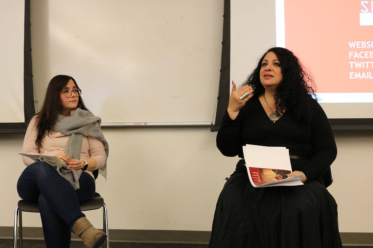 Maryam Griffin (left) of the University of Washington Bothell interviews art curator Alma Salem during her visit to the school on Feb. 7. Samantha Pak/staff photo