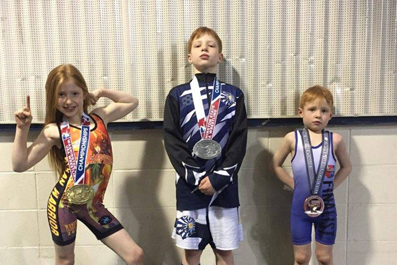Elementary school wrestlers Arabella Chapman, Alex Chapman and Briak Chapman competed at the 2019 WSWA Folkstyle state tournament on Feb. 17 at the Tacoma Dome. Photo courtesy of Connie Chapman