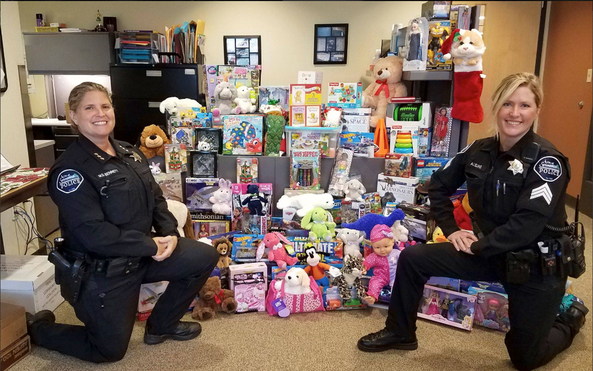 Sammamish Police Chief Michelle Bennett (left) and Christine Elias pose after a successful Toys for Tots drive in December 2018. Photo via Twitter