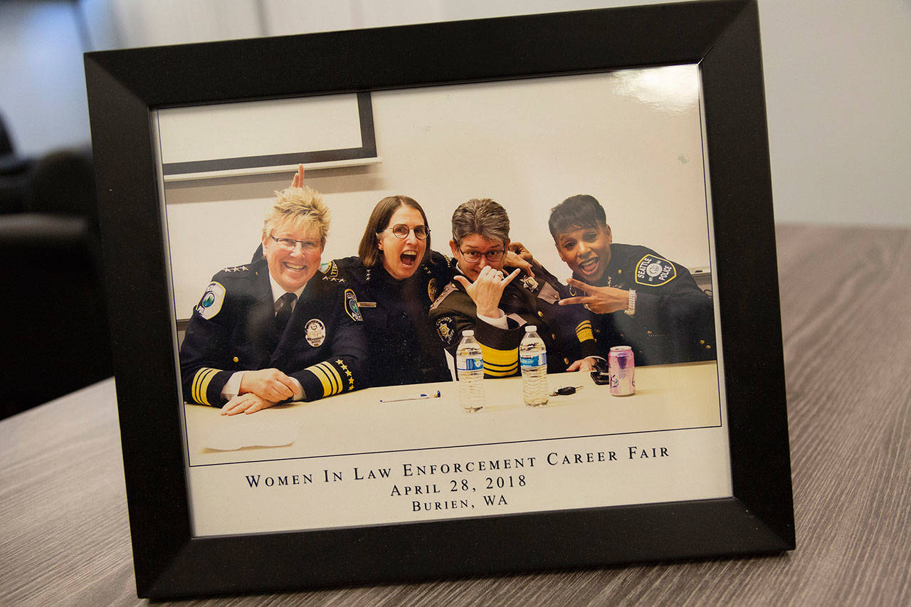 Redmond Police Chief Kristi Wilson, Bothell Police Chief Carol Cummings, King County Sheriff Mitzi Johanknecht and Seattle Police Chief Carmen Best smile in a photo on Johanknecht’s desk. They are some of Seattle’s leading women in law enforcement. Ashley Hiruko/staff photo