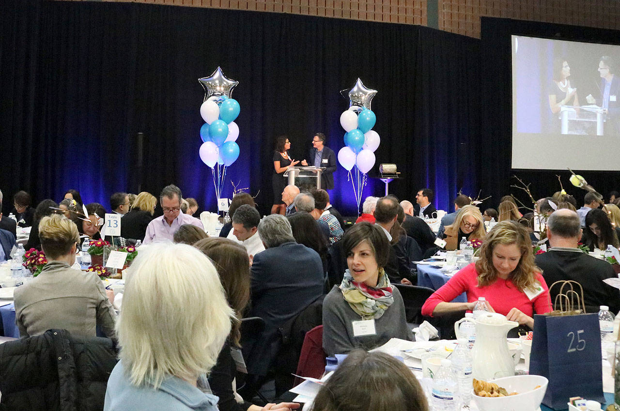 Mercer Island Youth and Family Services (MIYFS) Foundation Annual Breakfast Chair Lisa Katsman and Master of Ceremonies Bill Radke encourage Islanders to donate to the cause on March 6. Katie Metzger/staff photo
