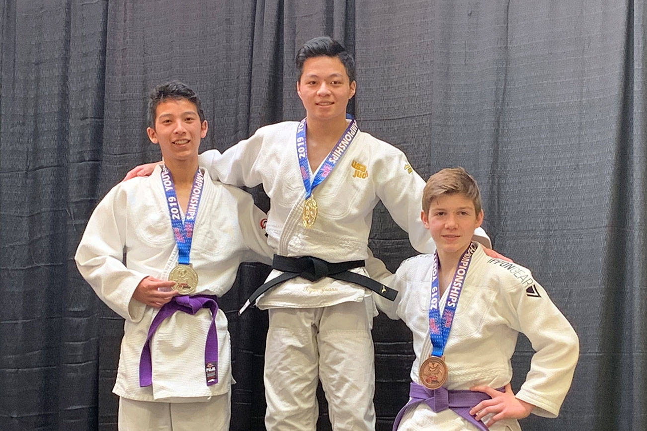Mercer Island High School sophomore Tegan Yuasa, center, stands on the top spot at the podium sporting a gold medal from the USA Judo Youth National Championships on March 10 in Colorado Springs, Colorado. Photo courtesy of Mark Yuasa