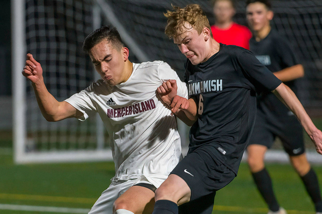 Mercer Island senior forward Dakota Promet, left, and Sammamish freshman Andrew Wilbert, right, battle for possession of the ball on March 26 at Sammamish High School in Bellevue. Mercer Island defeated Sammamish 1-0. Photo courtesy of Patrick Krohn/Patrick Krohn Photography