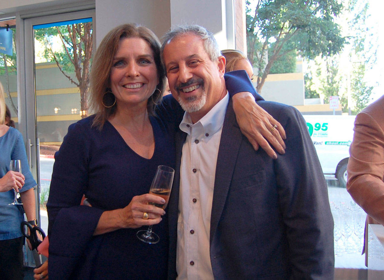 Lisa and Rino Caruccio pose before the ribbon cutting of Caruccio’s, a culinary event center on Mercer Island, in September 2017. Katie Metzger/file photo
