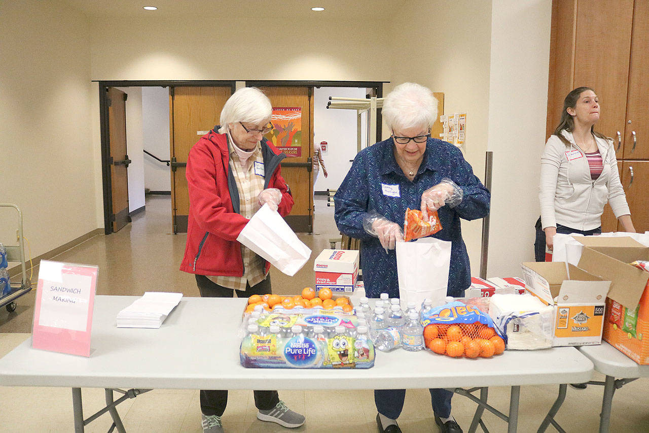 St. Jude Parish members made 125 sack lunches on March 30. Stephanie Quiroz/staff photo.