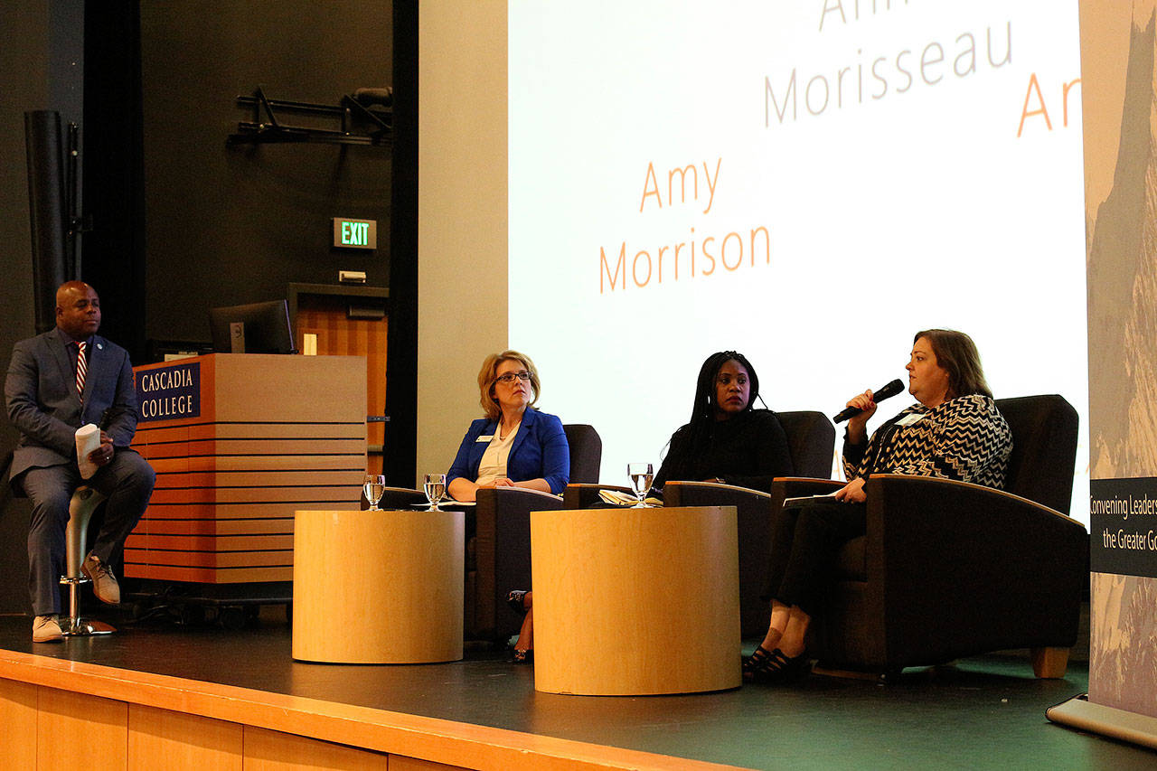 Madison Miller / staff photo                                James Whitfield, Leadership Eastside president and CEO, moderates The State of the Eastside and the American Dream with Dr. Amy Morrison, president of Lake Washington Institute of Technology, Anne Morisseau, planning commissioner for the city of Bellevue, residential real estate agent, LE board of directors, and Anne-Marie Diouf, VP human resources for Symetra.