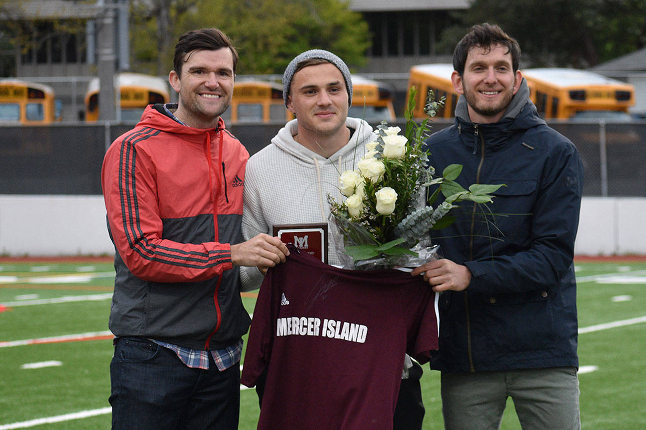 Former Mercer Island Islanders boys soccer head coach Colin Rigby, left, Jordan Morris, center, and Islanders boys soccer head coach Forrest Marowitz pose for a quick photo on April 23 at Islander Stadium. Morris was inducted into the Mercer Island High School Athletic Hall of Fame. Photo courtesy of Kim Otte