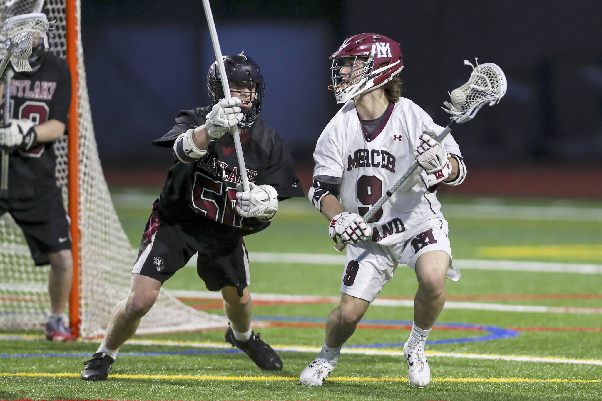 Mercer Island Islanders player Glen Mahony, right, scored three goals against the Eastlake Wolves on May 1. Mercer Island defeated Eastlake 17-4. Photo courtesy of Rick Edelman/Rick Edelman Photography