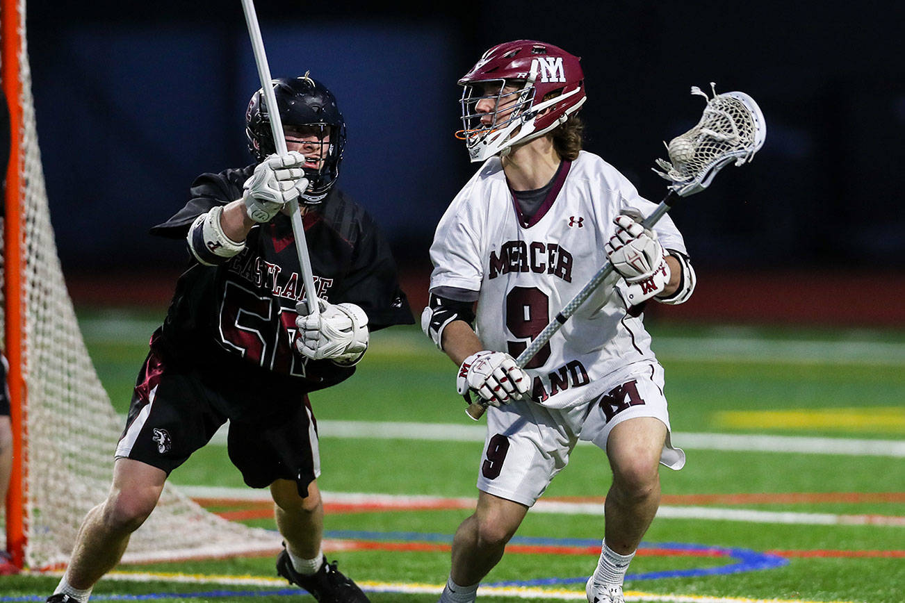 Mercer Island Islanders player Glen Mahony, right, scored three goals against the Eastlake Wolves on May 1. Mercer Island defeated Eastlake 17-4. Photo courtesy of Rick Edelman/Rick Edelman Photography