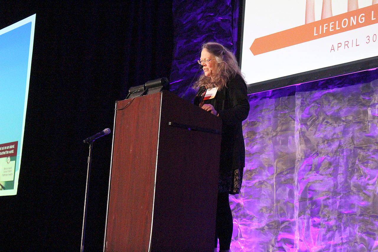 Madison Miller / staff photo                                 Pulitzer Prize-winning author, Caroline Fraser, receives a Pathfinder award at the 15th annual Breakfast of Champions fundraiser.