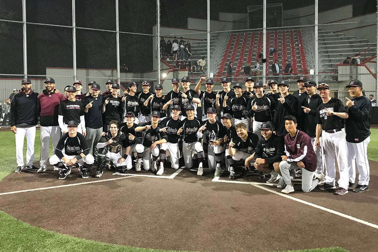 The Mercer Island Islanders pose for a team photo after clinching a berth at the Class 3A state tournament courtesy of a 10-3 victory against the Interlake Saints in the 3A KingCo championship game on May 6 at Bannerwood Park in Bellevue. Shaun Scott/staff photo
