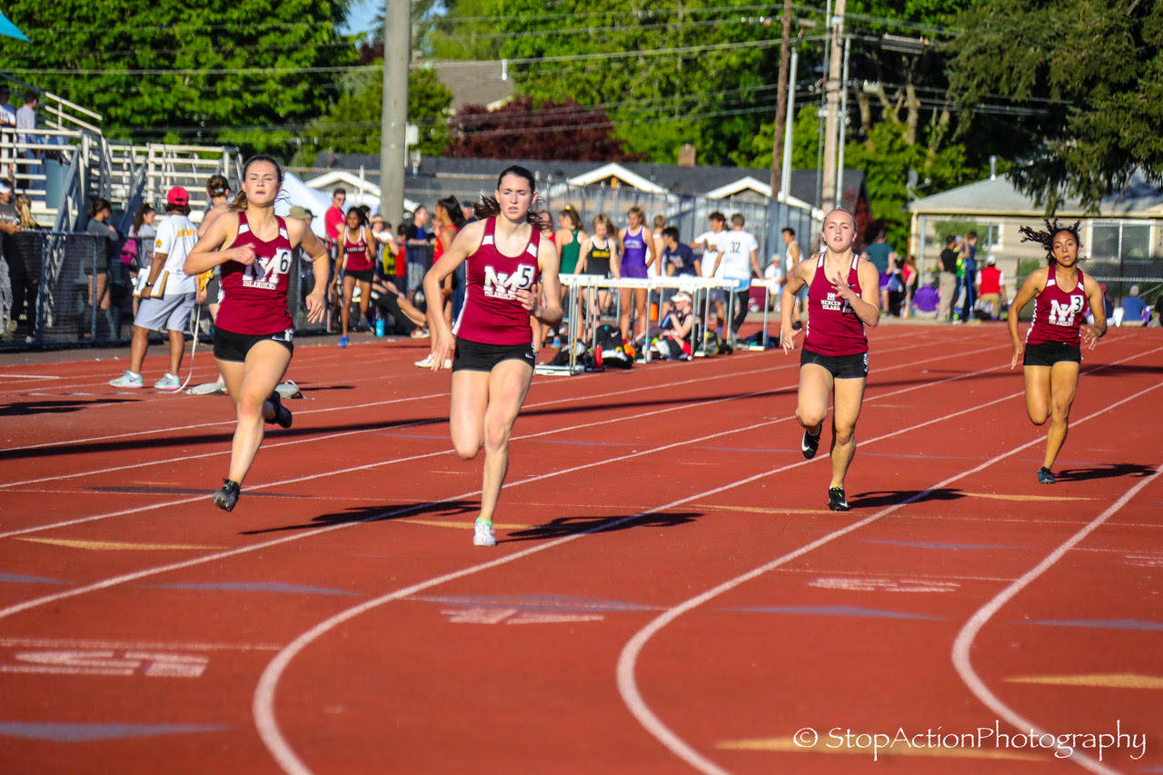 Mercer Island senior Maggie Baker (No. 5) captured first place in the 400 at the 3A KingCo track meet at Lake Washington High School in Kirkland. Photo courtesy of Don Borin/Stop Action Photography