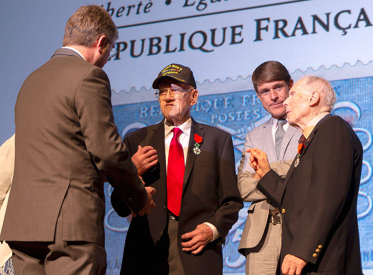 Issaquah resident Daniel F. McAllaster receives his French Legion of Honor Medal from the Consul General of France in San Francisco, Emmanuel Lebrun-Damiens at the Museum of Flight on May 10. Courtesy photo of the Consular Agency of France in Seattle                                The U.S. Veterans were awarded the French Legion of Honor Medal at the Museum of Seattle on May 10. Courtesy photo of the Consular Agency of France in Seattle