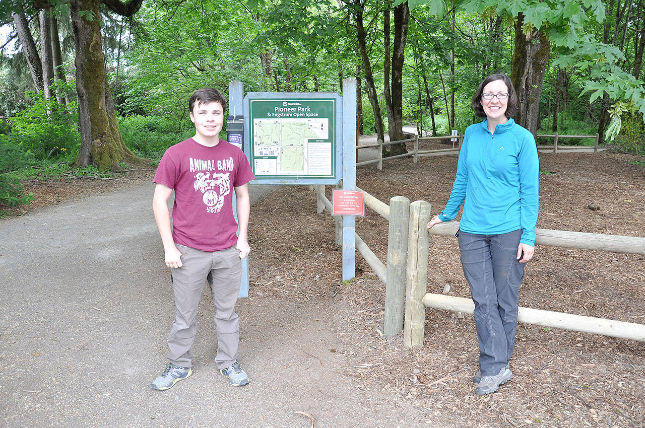 Eagle Scout Elliott Hendrickson and Kim Frappier from the City’s Parks and Recreation Department with the new Pioneer Park fence.