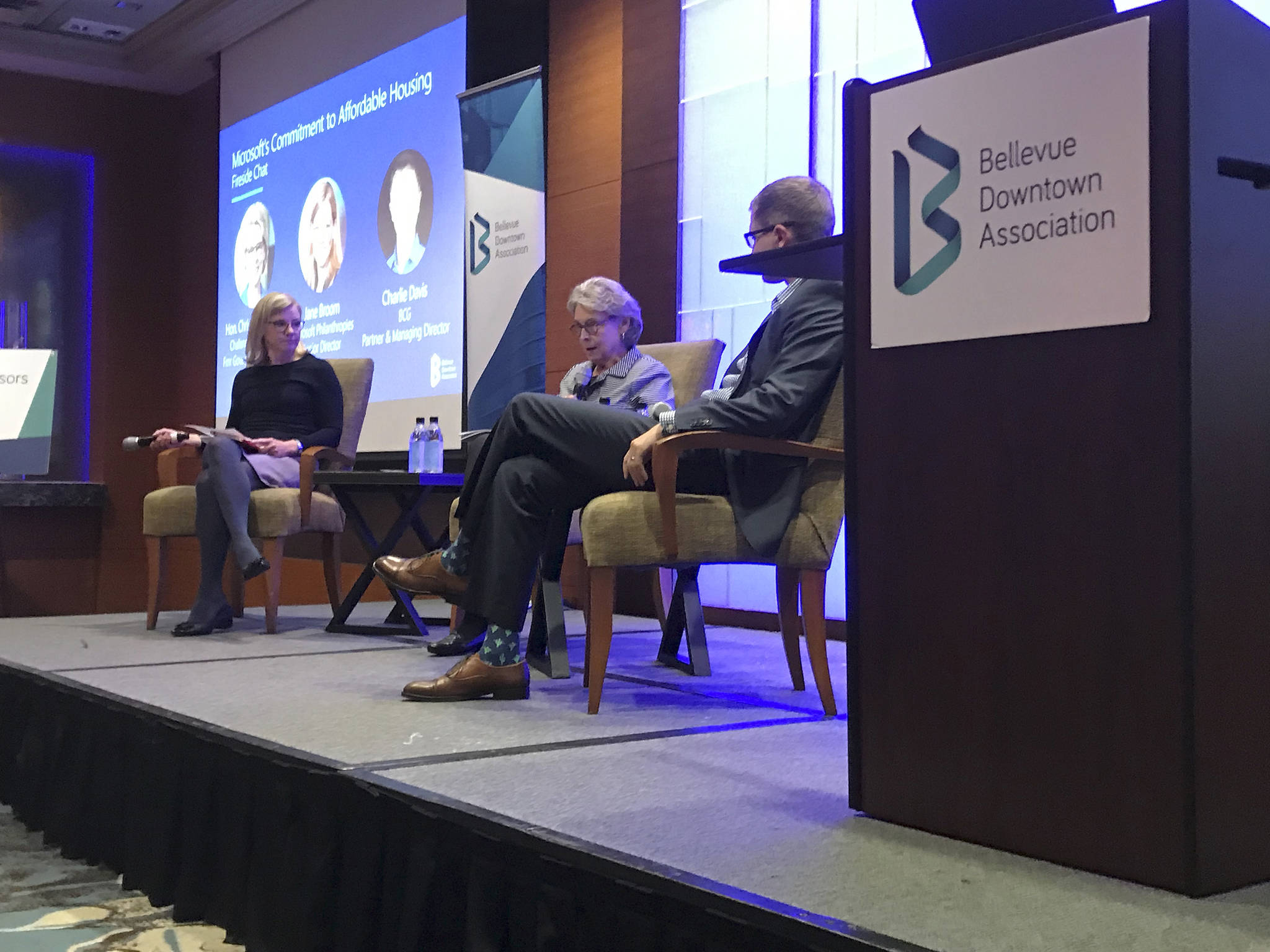 Kailan Manandic / staff photo                                (From left) Jane Broom, Microsoft Philanthropies senior director, former Washington Gov. Christine Gregoire, who now serves as CEO of Challenge Seattle, and Charlie Davis, partner and managing director at the Boston Consulting Group, speak on Microsoft’s $500 million commitment to affordable housing at a panel discussion during a Bellevue Downtown Association breakfast.