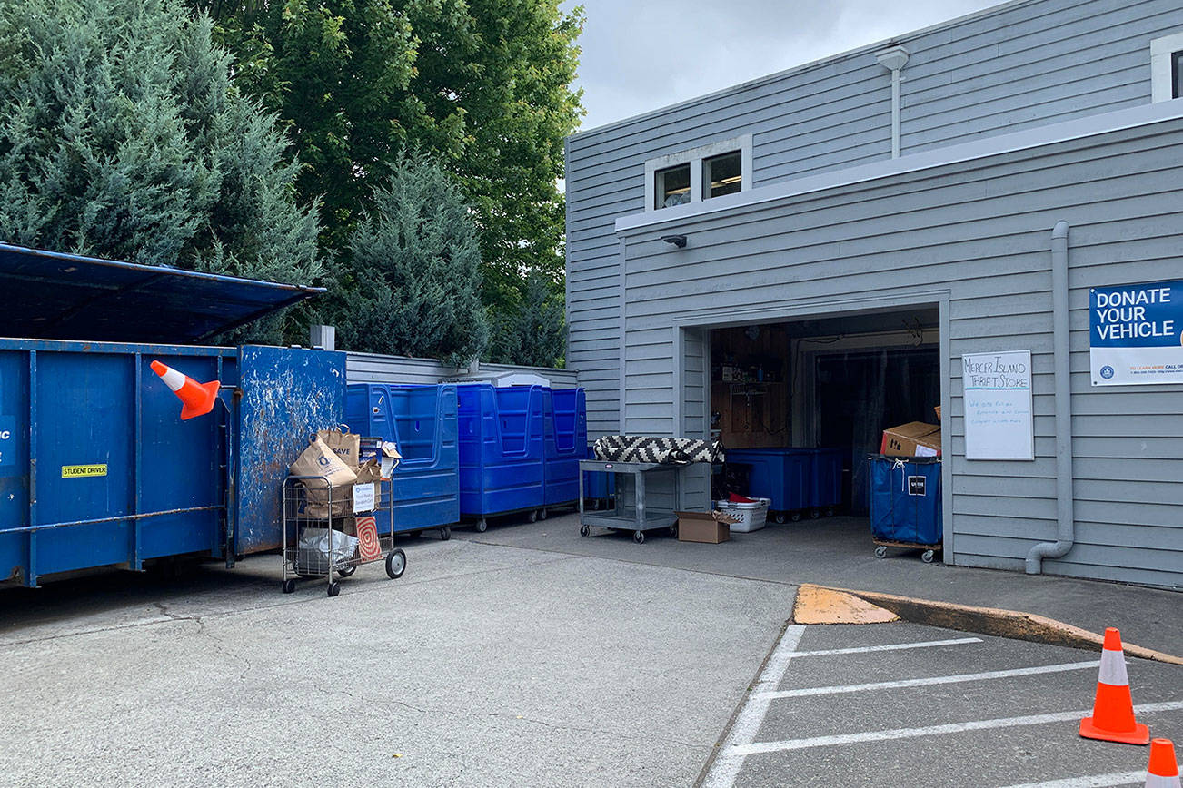 Blue bins at the side of the thrift side collect donations throughout the day before being sent over to Seattle Goodwill. Photo by Madeline Coats.