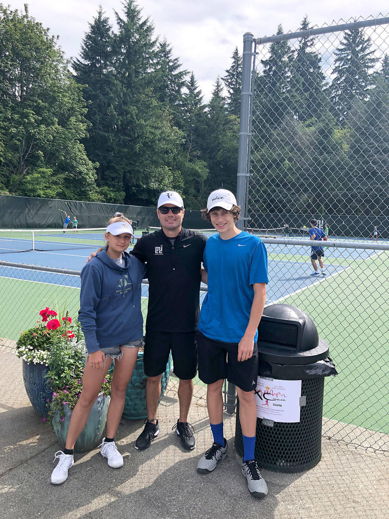 From left: middle schooler Valeriya Alekseykina, coach Jesse Walter, and Andrew Kaelin at the X-Out Cancer Fundraiser Jr. Tournament during the month of June. The team helped raise nearly $1658 which will help aid cancer families at Seattle Children’s. Courtesy photo of Gerry Kaelin