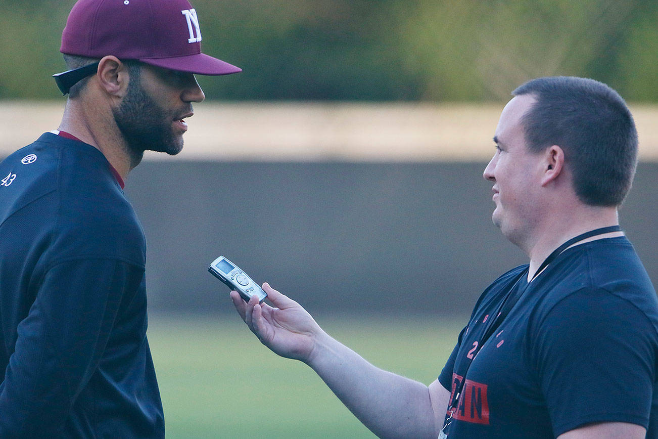 Sound Publishing sportswriter Shaun Scott, right, interviews Dominic Woody following a game against the Interlake Saints in April of 2019. Scott will be leaving Sound Publishing after 59 months on the job. Photo courtesy of Jim Nicholson